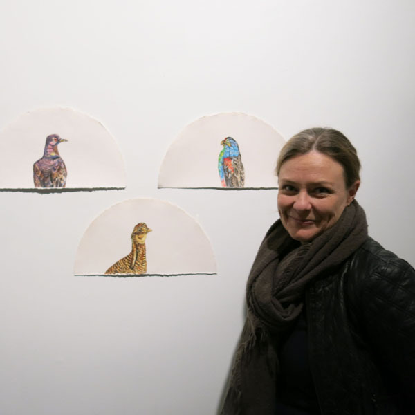 Emma standing in front of her work